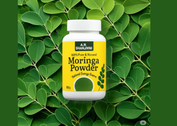 Container of A.R. Shanjivni 100% Pure & Natural Moringa Powder placed on fresh green moringa leaves background. Herbal energy supplement for boosting immunity, metabolism, and overall wellness. Bright yellow packaging with green organic design.